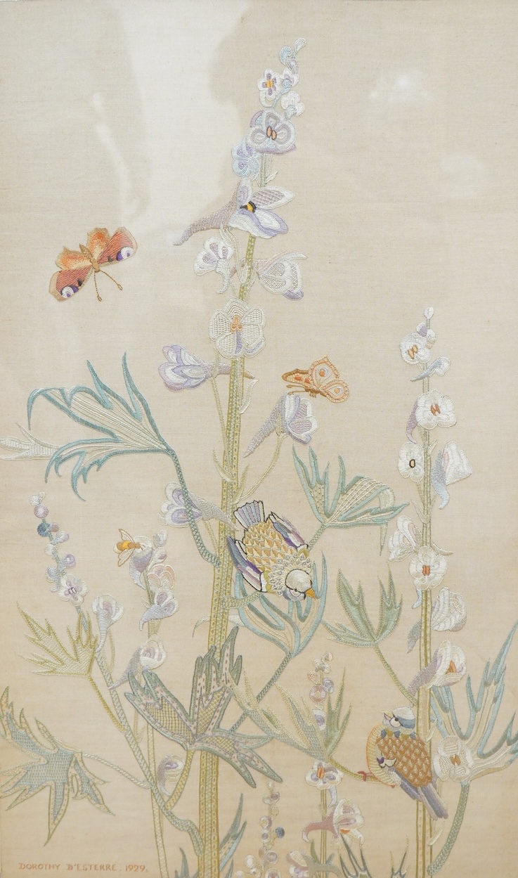 An early 20th century embroidery of birds amongst garden flowers worked in pastel colours, signed to the base Dorothy D'Esterre, dated 1929
